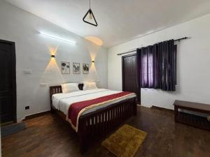 a bedroom with a large bed in a room at The White Haven Kotagiri in Kotagiri
