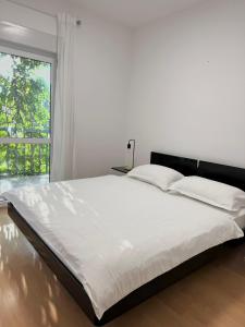 a large white bed in a room with a window at Villa Knez in Trogir +36 photos