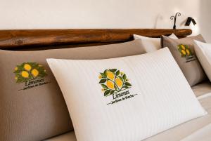 a pile of pillows sitting on a bed at Jardines de Ifonche in Ifonche