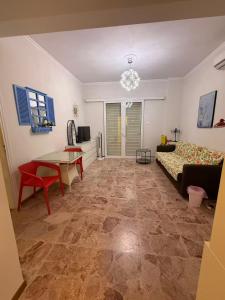 a living room with a couch and a table at Sail Haven in Vari