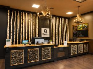 a lobby with a waiting area with a cash register at Quality Inn Fort Frances in Fort Frances