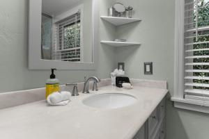 a white bathroom with a sink and a mirror at 826 Wilson Road in Highlands +49 photos