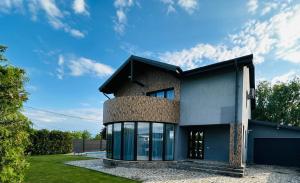a house with a blue at Luxury 3 Bedroom Pool Villa in Gulia