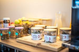 a table with several jars of seeds on a table at Strengen Guesthouse in Caldaro