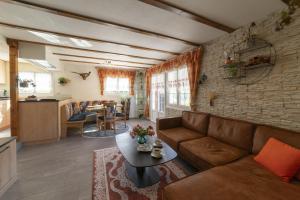 a living room with a couch and a table at Bergpanorama in Wildhaus