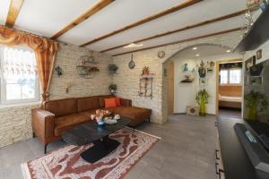 a living room with a couch and a table at Bergpanorama in Wildhaus