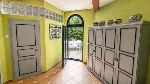 a room with a door and aoyer with yellow walls at Wasserturm Putbus in Putbus