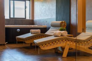 a waiting room with two beds and a window at MB Villas in Vrnjačka Banja