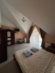 a bedroom with a bed with two trays on it at Admiral in Koblevo