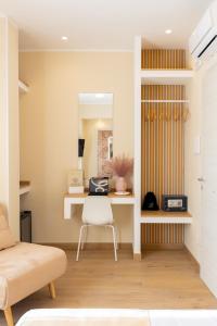 a living room with a desk and a chair at Lotus B&B in Messina