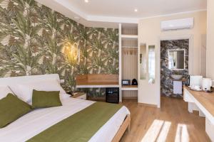 a bedroom with a bed and a wall mural at Lotus B&B in Messina