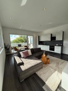 a living room with a couch and a table at Apartment Spitzenblick in Angerberg
