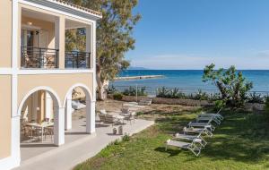 a house with a view of the ocean at Sandy Pines Villas in Alykes