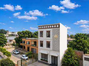 a white building with a gold star on it at The Leaf in Ludhiana