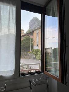 a window with a view of a mountain at Gerenz-home in Lecco