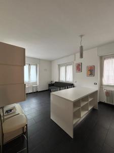 a kitchen with a white island in a room at Gerenz-home in Lecco