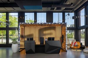a large screen in a room with windows at Aloft by Marriott Strasbourg City Centre in Strasbourg +34 photos
