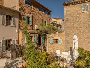 a building with a patio in front of it at C'AN Sabuba in Deia