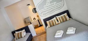 a small bedroom with a bed and a couch at On The Rocks in Qeparo