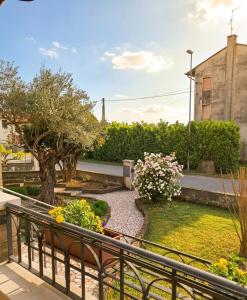 a view of a garden from a balcony at Casa Il Sogno in Vazzola