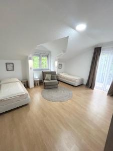 a large room with a bed and a couch at Kovač Home in Posušje