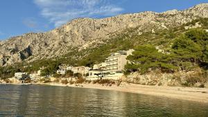a resort on the shore of a body of water at ADRIA MIRIS apartments in Drasnice +42 photos
