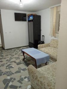 a living room with a coffee table and a couch at Ranč Pavić in Banja Luka