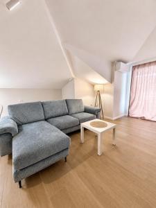 a living room with a couch and a table at Villa Lucija in Ohrid