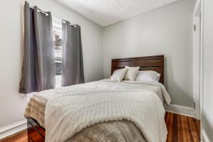 a bedroom with a bed and a window at Walkable 3-Unit Hub: 8 Mi to Micron Technology! in Phoenix