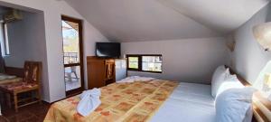 a bedroom with a large bed in a room at Хостел Бреза in Sunny Beach +56 photos