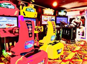 a room with video game controllers and video games at Amazing Star Wars Villa - Theater, Full Arcade & Private Pool, 5BR Near Disney in Orlando