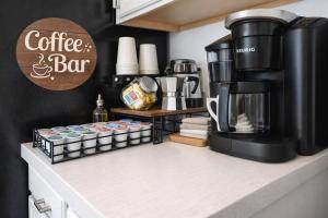 a coffee shop with a coffee and bar on a counter at Amazing Star Wars Villa - Theater, Full Arcade & Private Pool, 5BR Near Disney in Orlando
