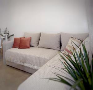 a couch with two pillows on it in a living room at Central in Argostoli