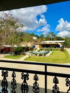 a view of a park from a balcony at Hotel Estação Chico in Garanhuns