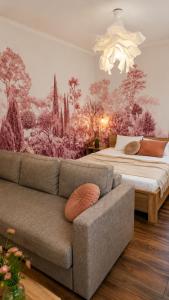 a living room with a couch and a bed at Central City Balcony Apartments in Mukacheve