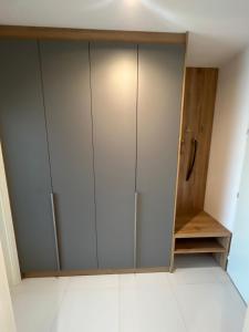 a closet with white cabinets in a room at AH Terrace Jacuzzi Suite near Arena in Košice