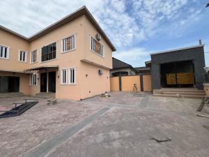 a large house with a driveway in front of it at sky 7 hotel & apartment in Akure