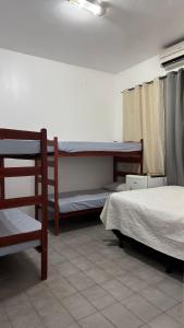 a room with two bunk beds in a room at Pousada Point da Nanda in Juazeiro do Norte +28 photos