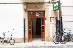 two bikes parked in front of a building at Musika Plaza in Zarautz +41 photos