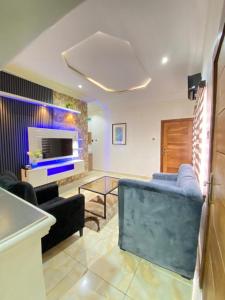 a living room with a couch and a fireplace at D-SHA Apartments in Aja