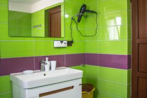 a bathroom with a sink and a mirror at CASTLE View SERENITY -- BERAT in Berat +21 photos