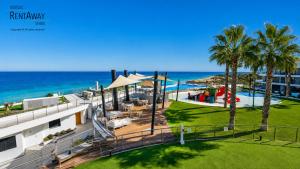 an aerial view of a resort with the ocean at Infinity View Apartments by NRAS in Arenales del Sol +45 photos