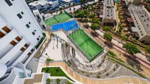an aerial view of a tennis court in a city at Infinity View Apartments by NRAS in Arenales del Sol