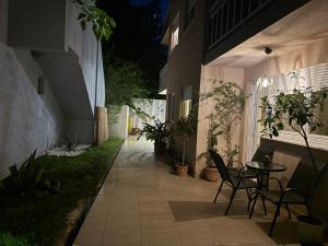 a patio with chairs and a table in a building at Tara Apartment in Herceg-Novi