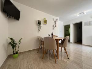 a dining room with a table and chairs at Apartments Bepo in Komiža