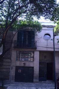 a building with a black door and a balcony at Rio amazonas 7 in Mexico City +48 photos