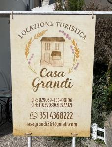 a sign for a casona grandita with a house at Casa Grandi in Ca Tiepolo