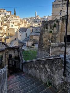 a view of a city with stairs and buildings at Vistasassi rooms in Matera