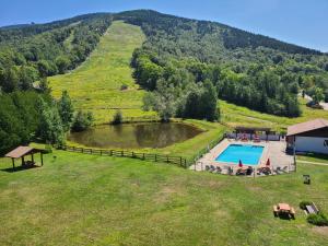 an aerial view of a swimming pool on a hill at Mittersill Alpine Resort in Franconia
