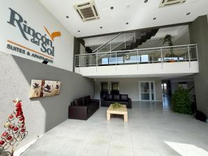 a lobby with a staircase and a living room at Suite Pinamar 09 in Pinamar +20 photos
